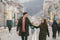 Young couple, heterosexual boy and girl of Caucasian nationality, loving couple, walk around the center of country of European