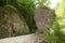 Young couple on a hike at rock formation on a hot summer day