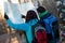 Young couple hikers looking at map.