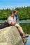 Young couple hikers lounging at lake nature