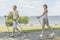 Young couple hiking in the nature nordic walking naer the lake