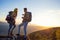 Young Couple Hiking On The Peak of Mountain drinking water