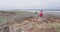 Young Couple Hiking Wearing Backpacks While Walking At Shipwreck Beach Lanai