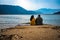 Young couple holding each other and looking the serene natural beauty at day from flat angle