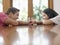 Young Couple Holding Hands On Table