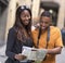 Young couple on holiday with a map