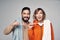 Young couple with home towels and toothbrushes with toothpaste