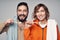 Young couple with home towels and toothbrushes with toothpaste