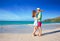 Young couple hugging at beautiful Cote d`Or Beach. Praslin, Seychelles