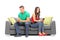 Young couple ignoring each other seated on a sofa