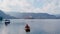 Young couple kayaking together and enjoying magnificent view of the Alph mountains during honeymoon. Bird`s-eye or drone