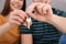 Young couple with key from their new house indoors, closeup