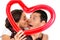 Young couple kissing balloon heart surprise