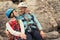 Young couple in love climbers. man and woman hanging on a rock on ropes. climbing, extreme sport