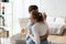 Young couple in love dancing embracing together at home