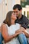 Young Couple In Love Embrace On Gazebo Steps