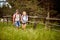 A young couple in love enjoys chatting while hiking in the nature. Hiking, relationship, nature, activity