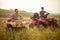 A young couple in love enjoys riding quads in the nature. Riding, nature, relationship, activity