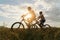 Young Couple in love fun and happy riding mountain bike after covid-19 coronavirus outbreak. End of the coronavirus outbreak.