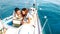 Young couple in love having fun with tablet pc on sailboat - Luxury travel life style and digital nomad concept