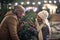 A young couple in love having good time viewing a christmas tree on a snowy weather in the city. Christmas tree, love,