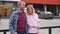 Young couple in love, hugging on the street. Selective focus. woman and man stand on the background of the city