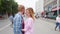 Young couple in love, hugging on the street. Selective focus. woman and man stand on the background of the city