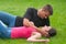 Young couple in love lying on the grass