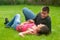 Young couple in love lying in the grass