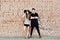 Young couple in love outdoor - full length portrait