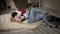 A young couple in love passionately embraces at home on the floor near the bed.