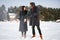 Young couple in love play with snow in winter park outdoor