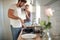 A young couple in love preparing breakfast in the kitchen. Cooking, together, kitchen, relationship