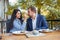 Young couple in love is sitting in cafe and woman is feeding cake her man.