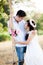 Young couple in love sitting on swing and look each other