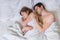 Young couple in love sleep together in bed