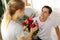 Young couple lover surprise give rose flower in valentine`s day.