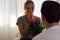 Young couple lover surprise give rose flower in valentine`s day.