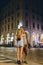 A young couple of lovers kissing on the night streets of old italy. Summer evening. Tourism and vacation. Relationships and love.