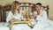 Young couple lovers romantic breakfast in bed