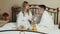 Young couple lovers romantic breakfast in bed