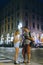 A young couple of lovers walking the night streets of old italy. Summer evening. Tourism and vacation. Relationships and love.