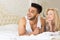 Young Couple Lying In Bed, Happy Smile Hispanic Man And Woman Lovers In Bedroom