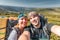 Young couple making selfie snow resort mountain