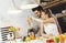 Young couple mixing fruit in a food processor