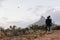 Young couple navigating a flying drone in sky