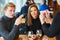 Young couple orders food at the waiter in the restaurant