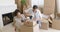 Young couple packing boxes to move home