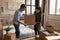 Young couple packing relocating to new house