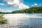 Young couple paddle boarding in Lake Lanier next to waterfront properties